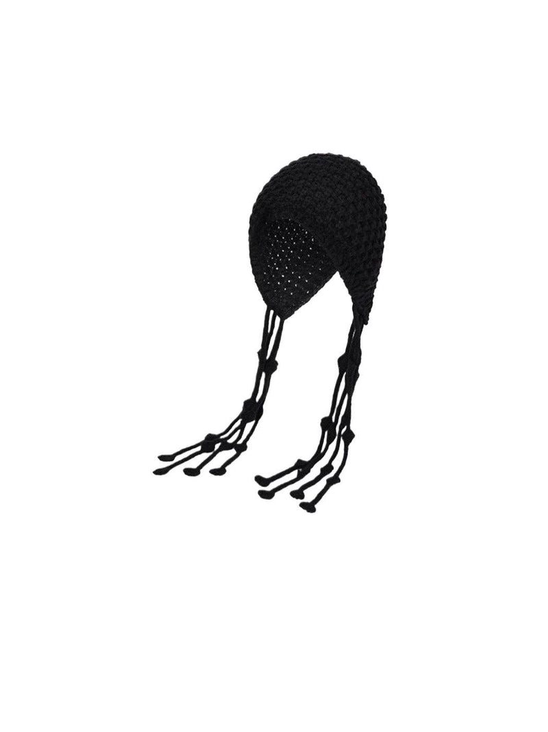Black knit beanie with tassels on a white background