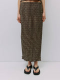 Person wearing a plaid skirt on a white background