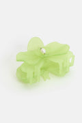 Light green hair clip on a white background