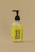 Bottle of Hinoki Sesame on a beige background