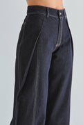 Dark blue jeans on a plain background