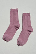 Pair of pink socks on a light gray background