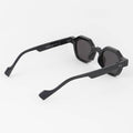 Black sunglasses with a unique design on a white background