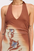 Brown halter top with a tie-dye skirt on a plain background