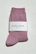 Pair of pink socks with a 'Le Bon Shoppe' label on a light gray background