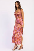 Woman wearing a patterned dress on a white background
