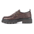 Brown woven leather shoe on a white background