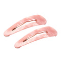 Two light pink hair claw clips with gold-tone metal springs, displayed on a clean white background.