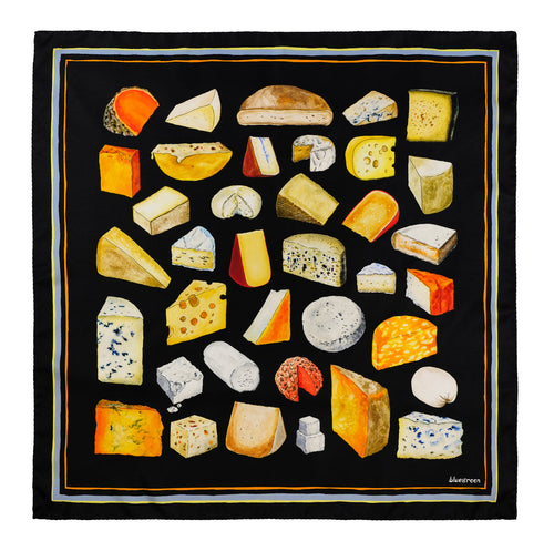 A silk scarf with a variety of hand painted cheeses arranged in a square with a green background and a stripe border.