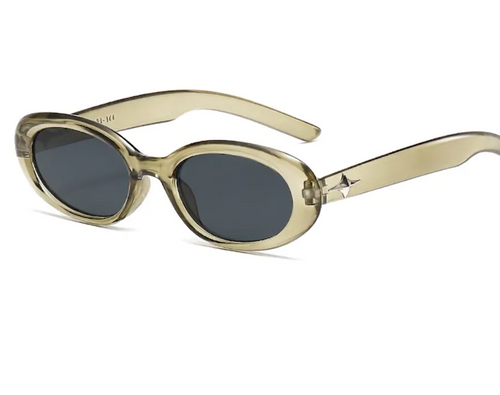 Sunglasses with clear green frame and dark lenses on a white background