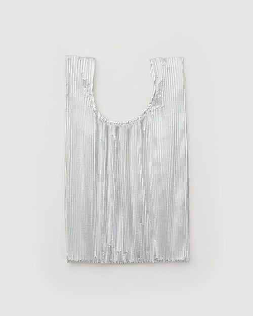 Silver fringe bag on a light gray background