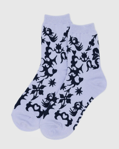 Light purple socks with black geometric pattern on a white background