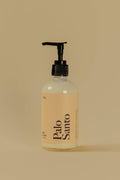Bottle of Palo Santo on a beige background