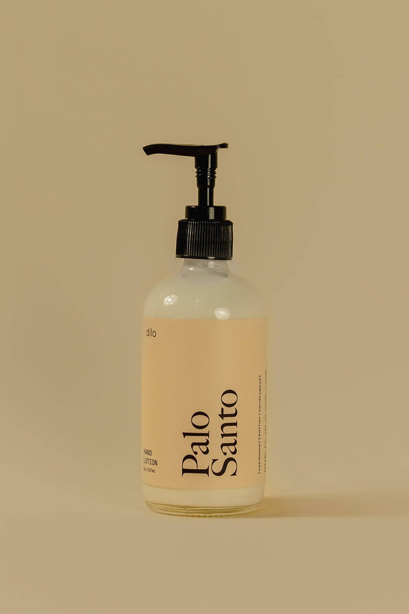 Bottle of Palo Santo on a beige background