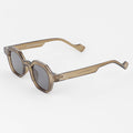 Sunglasses with a brown frame and dark lenses on a white background