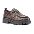 Brown woven shoe with a thick sole on a white background