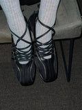 black lace up shoes with white detailing