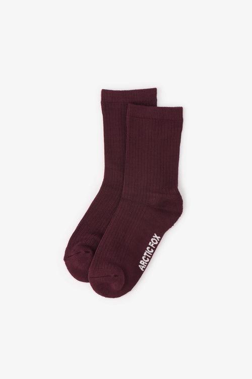 Pair of maroon socks with a brand logo on a white background