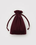 Maroon ribbed drawstring pouch on a white background